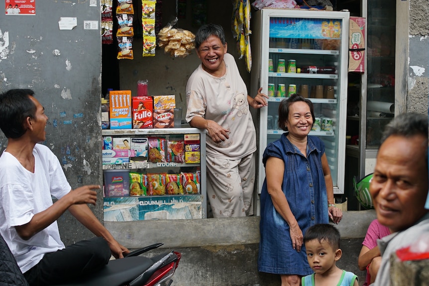 Shop owner in Tambora slum