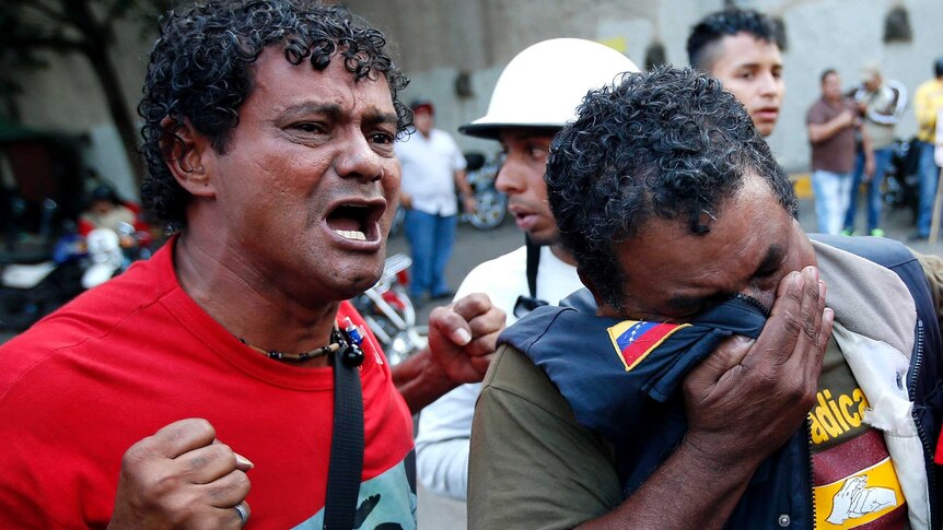 Hugo Chavez supporters react to his death.