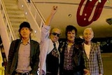 Rolling Stones with plane in the background with logo.