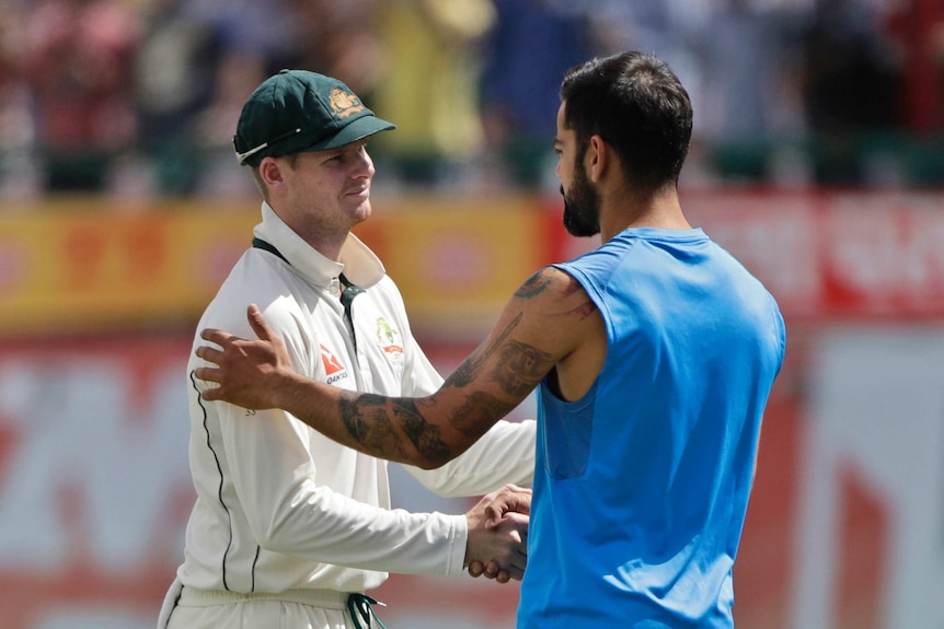 Steve Smith and Virat Kohli shake hands after the final Test series in Dharmashala.