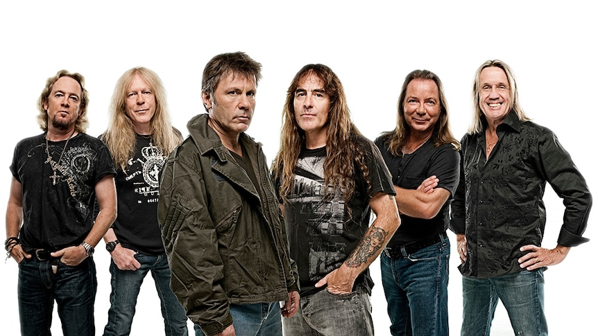 Iron Maiden stand in front of a stark white background