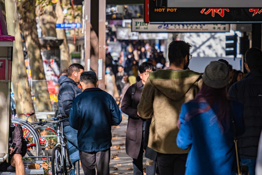 People walking down street