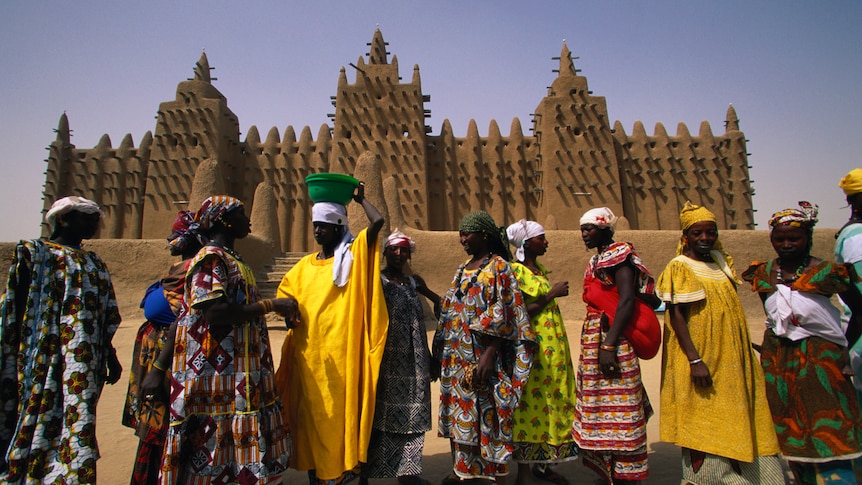 Women gathered in front of the Djenné mosque in Mali. (image: Getty / Glen Allison)