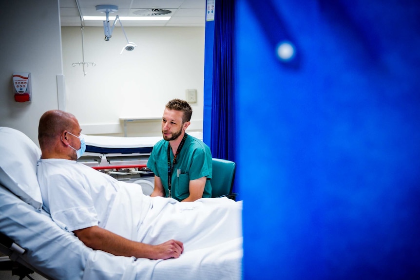 A doctor talking to a patient