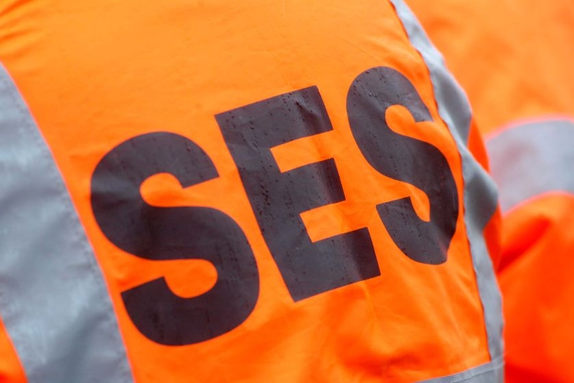 SES logo, black on orange background