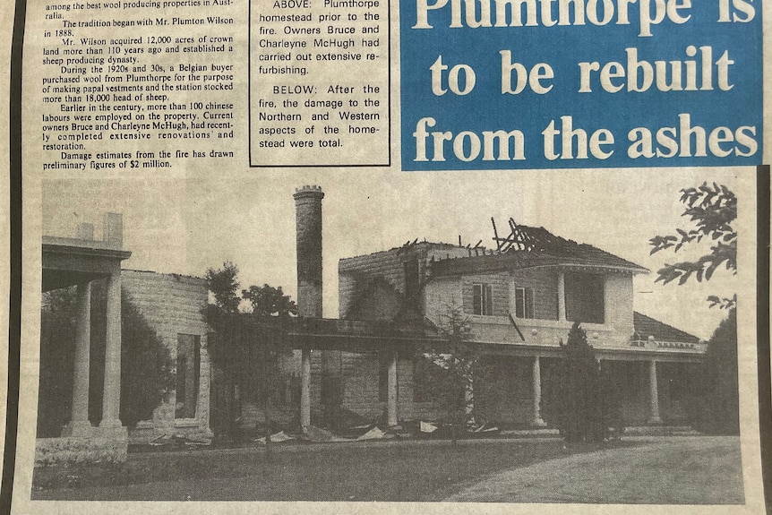 A newspaper excerpt of a palatial home with fire damage to the top floor.