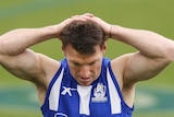 Brent Harvey takes a break at training