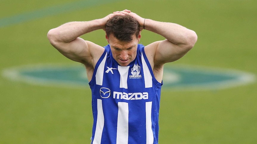 Brent Harvey takes a break at training