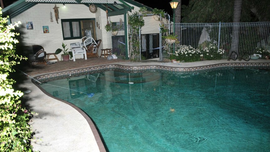 The pool at the Spenceley's property at night.