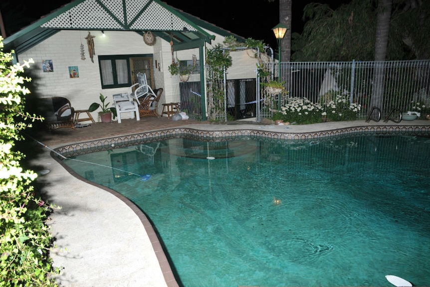 The pool at the Spenceley's property at night.