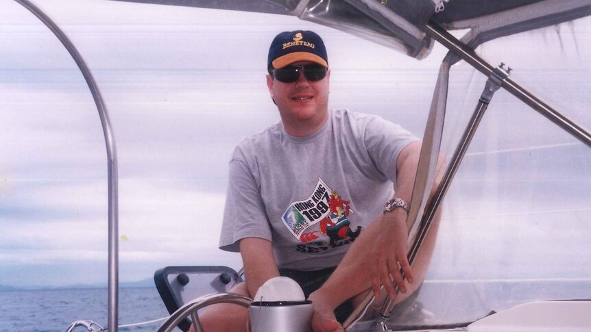 Tim Nicholls sits on a boat's deck in the Whitsundays in north Queensland on a bareback charter in 1994.