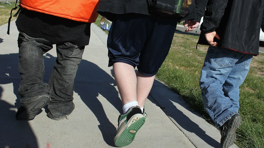 Generic of the backs of three unidentified school kids, one overweight