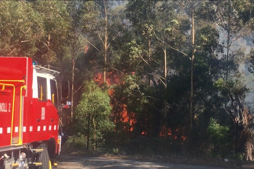 Flames and a fire truck at the Carrum Downs fire.