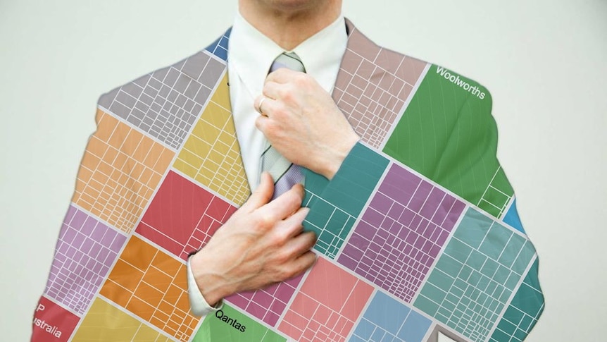 A man in a business suit adjusts his tie. There is a chart superimposed over his suit.