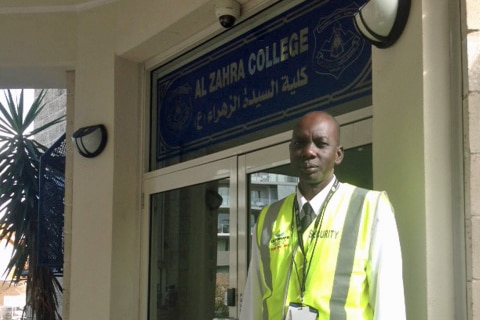 A security guard at Al Zahra College in Sydney