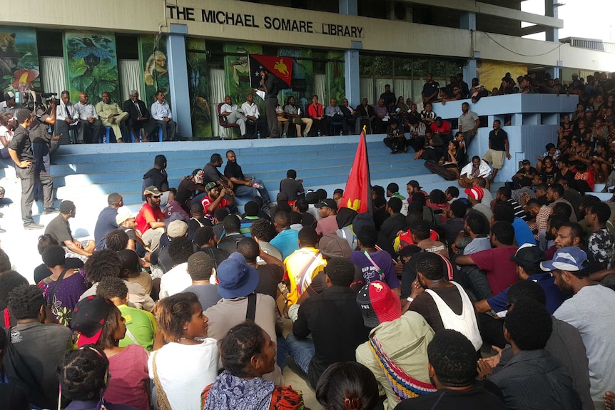 Student protesters at the University of PNG holding a sit-in at the library