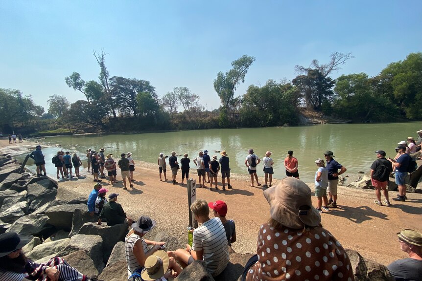 tourists at croc-infested river