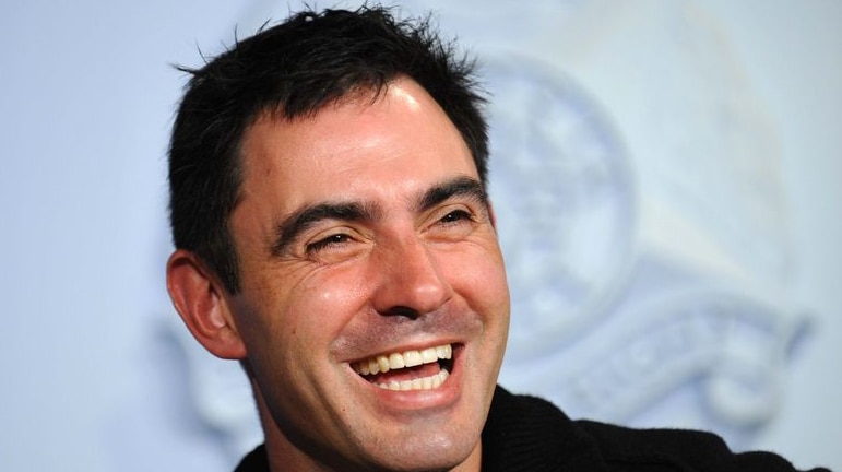 Victorian Water Minister Tim Holding smiles as he speaks at a press conference in Melbourne