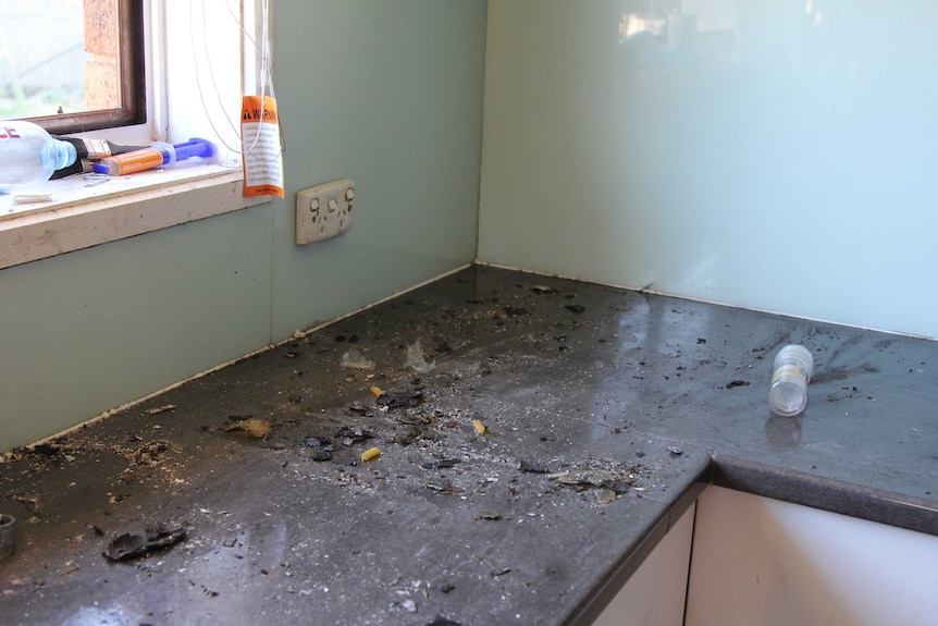 A burnt kitchen bench after a fire.