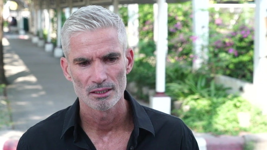 Craig Foster speaks with the media in Bangkok.