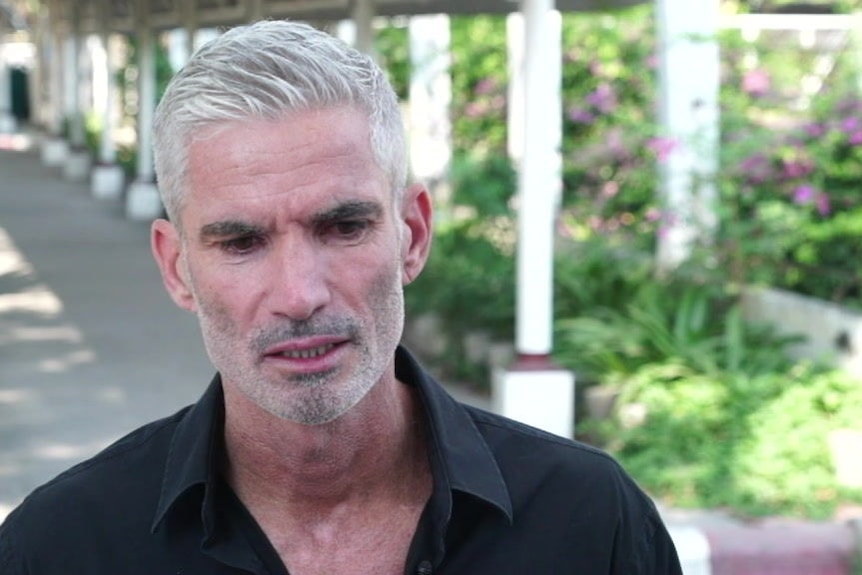 Craig Foster speaks with the media in Bangkok.