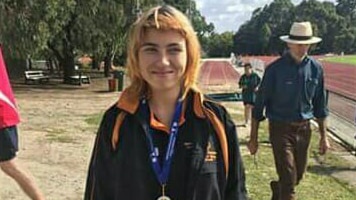Teenager Teresa poses after a school sports meet