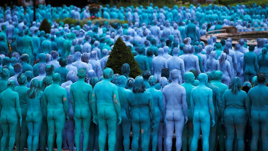 Nude painted models pose for photograph at Hull, in northern England in 2016.
