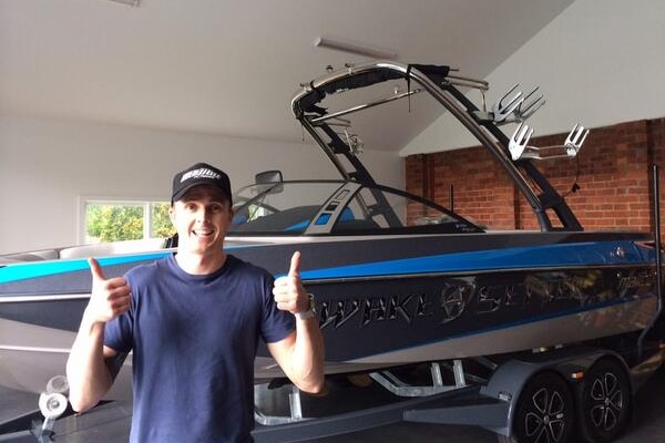 Winterbottom gives the thumbs up, with his boat in the background