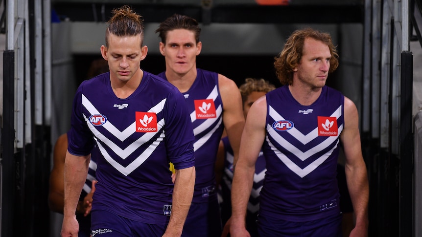 Nat Fyfe leads the team out alongside David Mundy