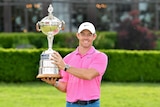 Rory McIlroy poses with the Canadian open Trophy at the Hamilton Golf and Country Club