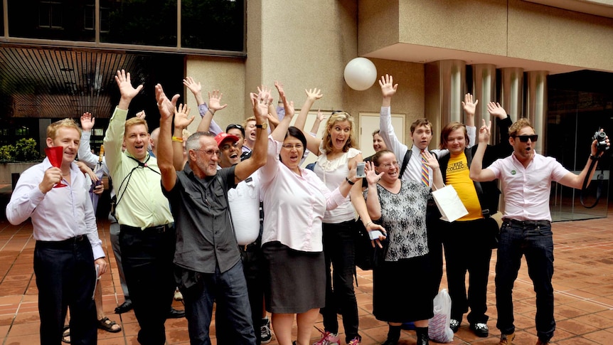 Gay couples, friends and their supporters pose for the cameras