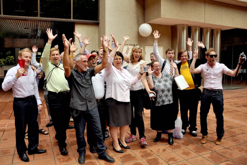 Gay couples, friends and their supporters pose for the cameras