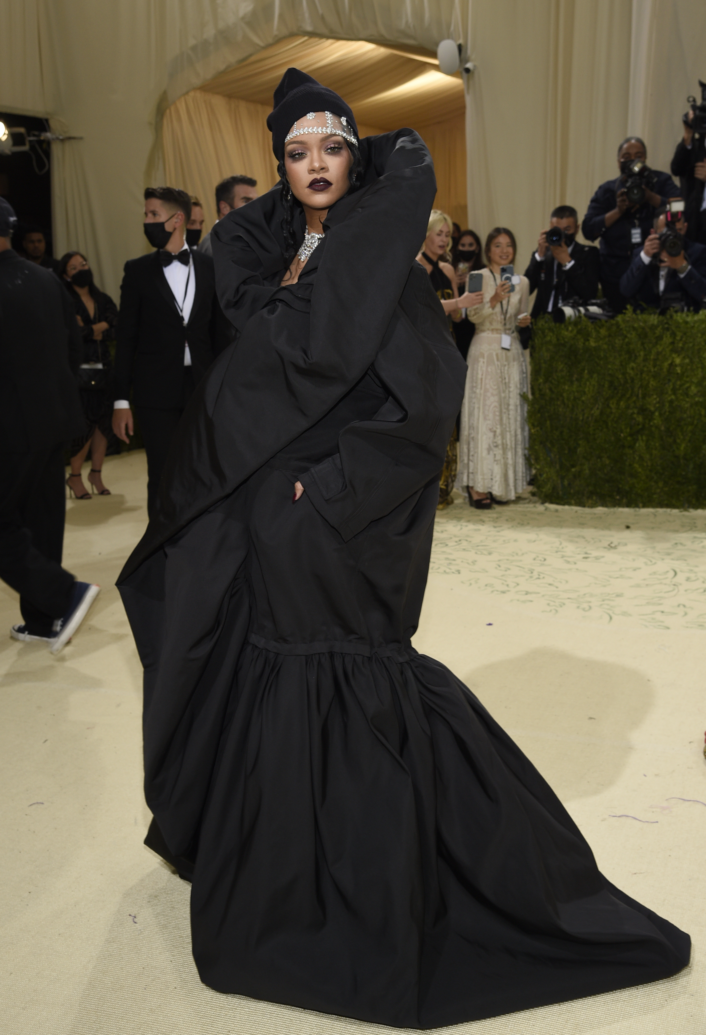 Rihanna in a big black gown.