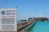 A Port of Broome sign with a live export ship in the background. November 2015