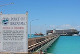 A Port of Broome sign with a live export ship in the background. November 2015