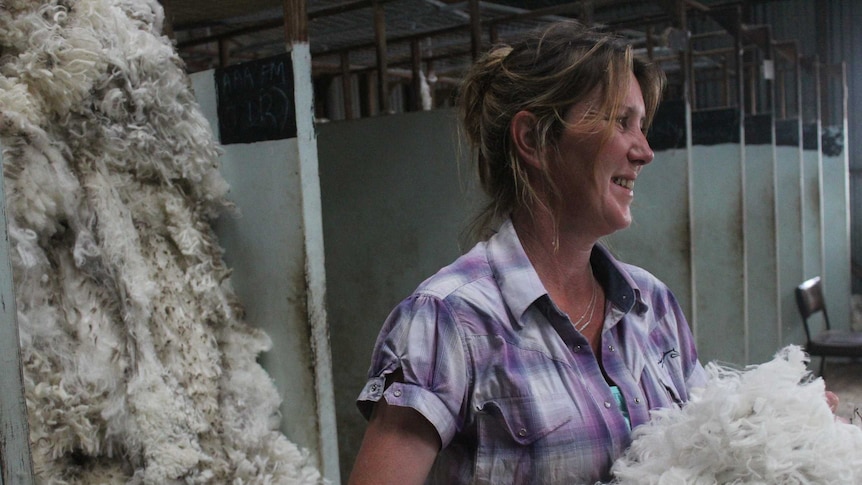 A photo of Helen van Vondel working in a shearing shed.