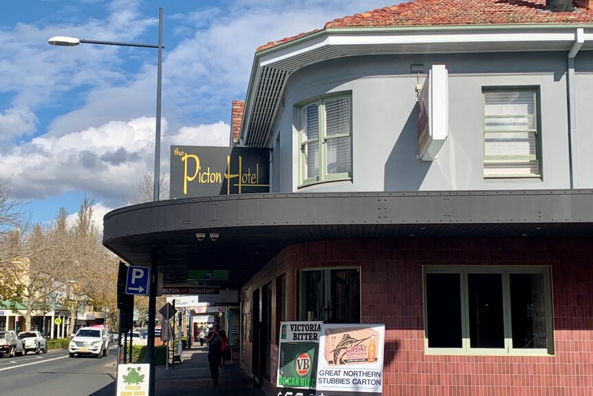 A corner pub with a sign saying the Picton Hotel.