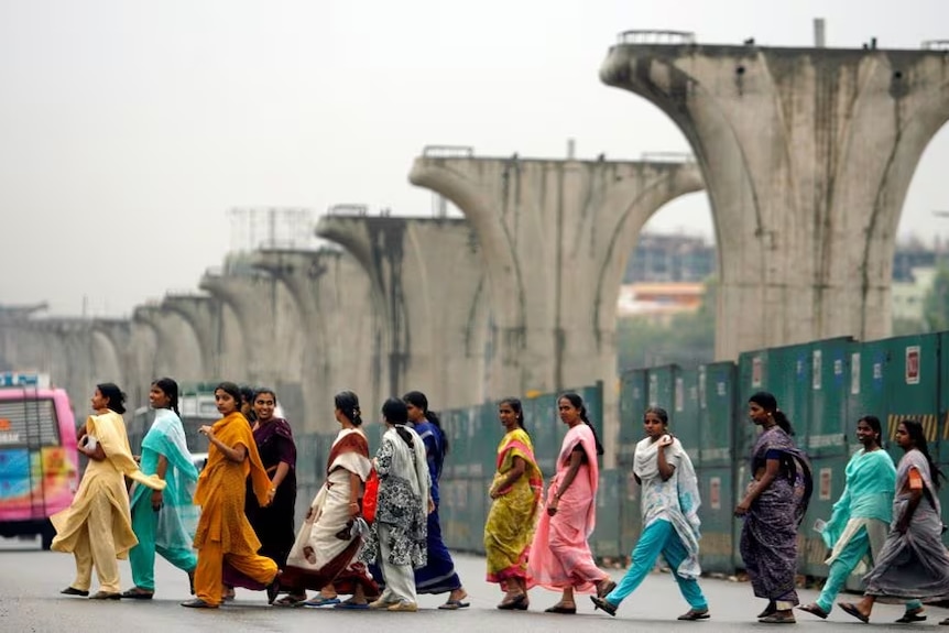 Indian women walking - Reuters