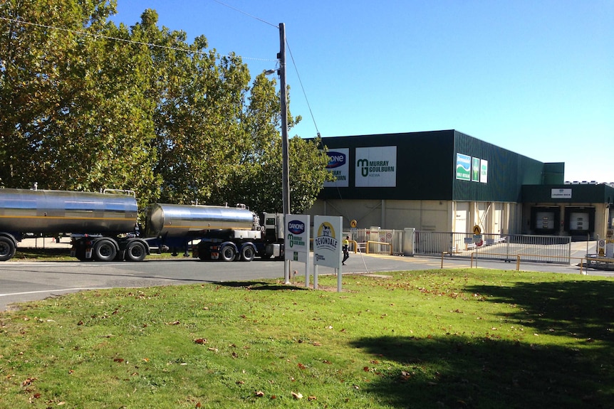 A large silver milk tanker is parked on the driveway outside the gate of the Murray Goulburn plant in Kiewa.