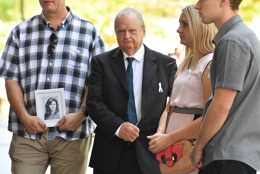 Jon Knowles (centre), father of victim Patricia Riggs, outside the Supreme Court in Brisbane.