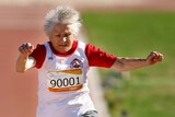 Olga Kotelko, 90, leaps in the 70+ women's long jump during the Sydney 2009 World Masters Games.