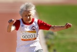 Olga Kotelko, 90, leaps in the 70+ women's long jump during the Sydney 2009 World Masters Games.