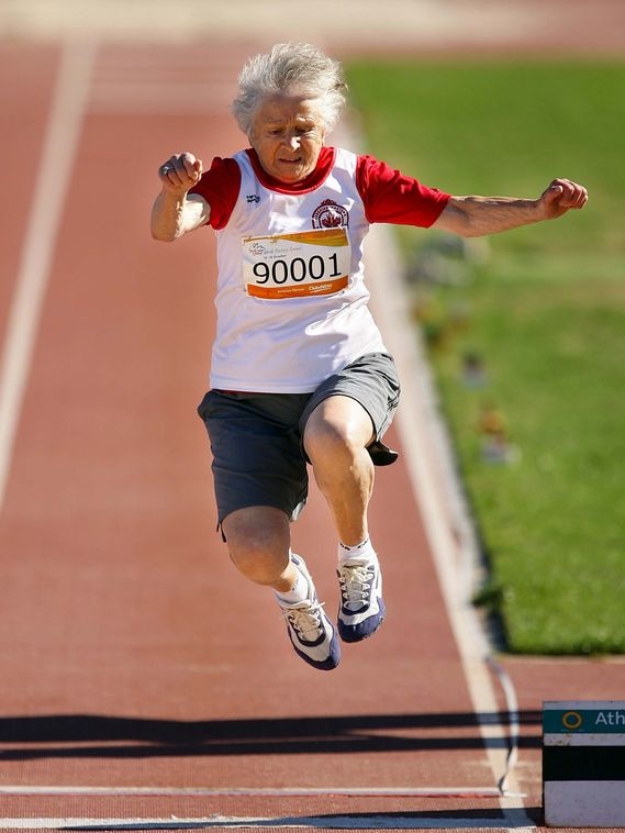 Olga Kotelko, 90, leaps in the 70+ women's long jump during the Sydney 2009 World Masters Games.