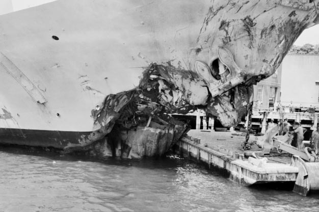 black and white image of a smashed up boat bow