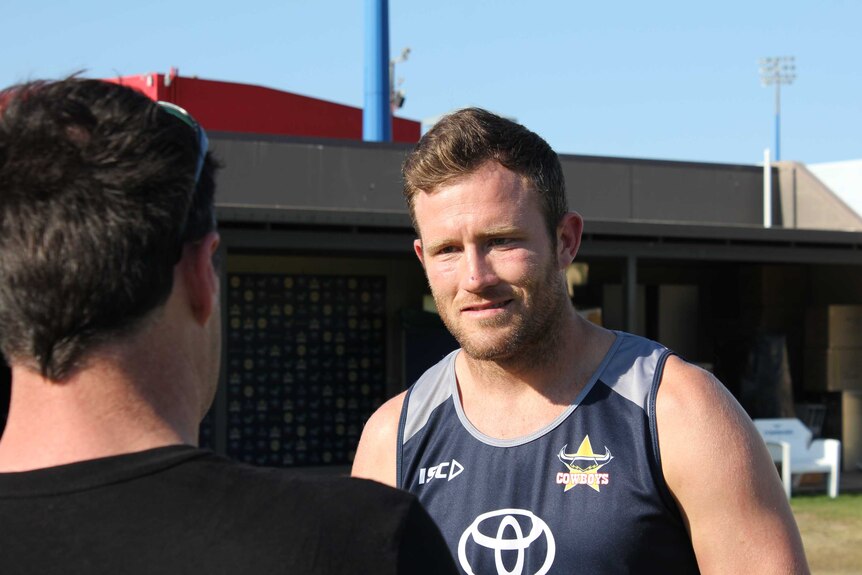 Cowboys player Gavin Cooper talks to the media in Townsville in grand final week.