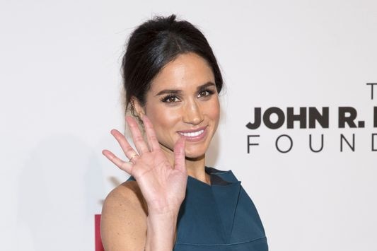 Meghan Markle waves to cameras