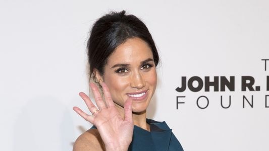 Meghan Markle waves to cameras