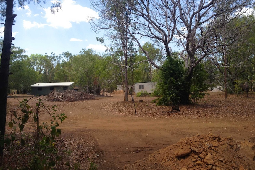 Bushland and donga housing.