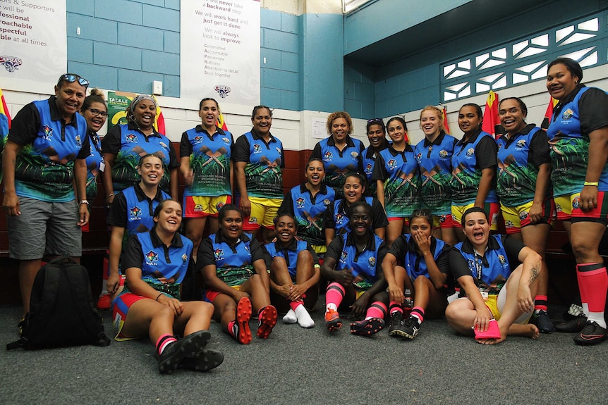 women in a locker room in sports gear