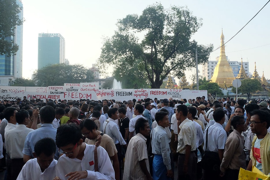 Protesters on a street in Yangon demand freedom for political prisoners.